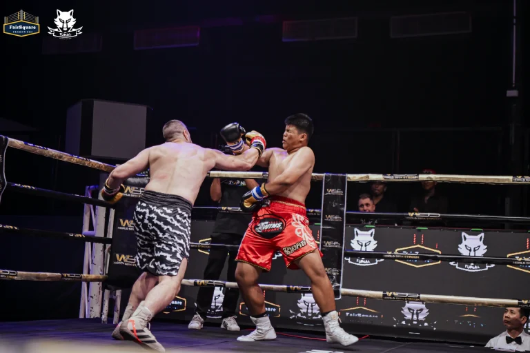 An exchange in the ring · Breakthrough II, 12 March 2026.